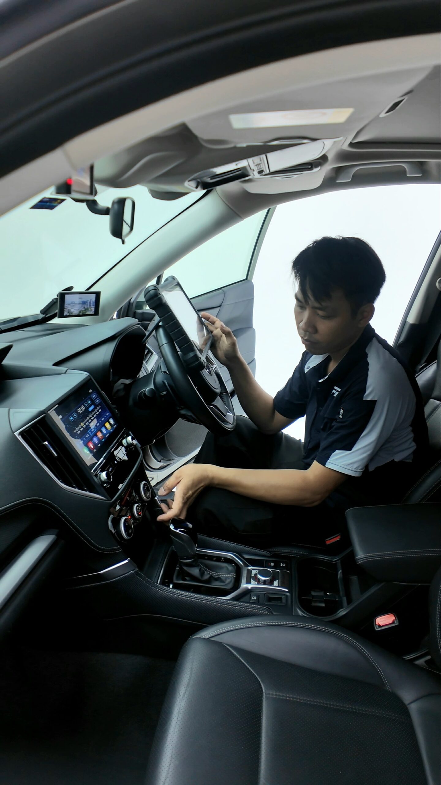 Interior and electronic checks during used car inspection