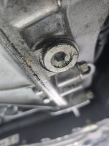 Oil staining found during used car undercarriage inspection