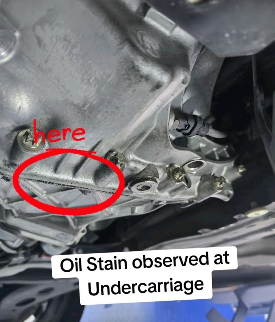 Transmission oil staining observed during used car inspection in Singapore
